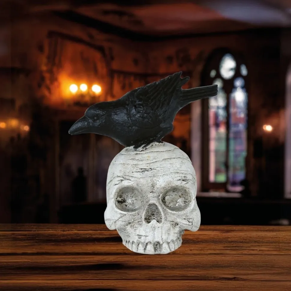 CORBEAU PERCHÉ SUR CRÂNE DÉCO RÉSINE 14X9CM
